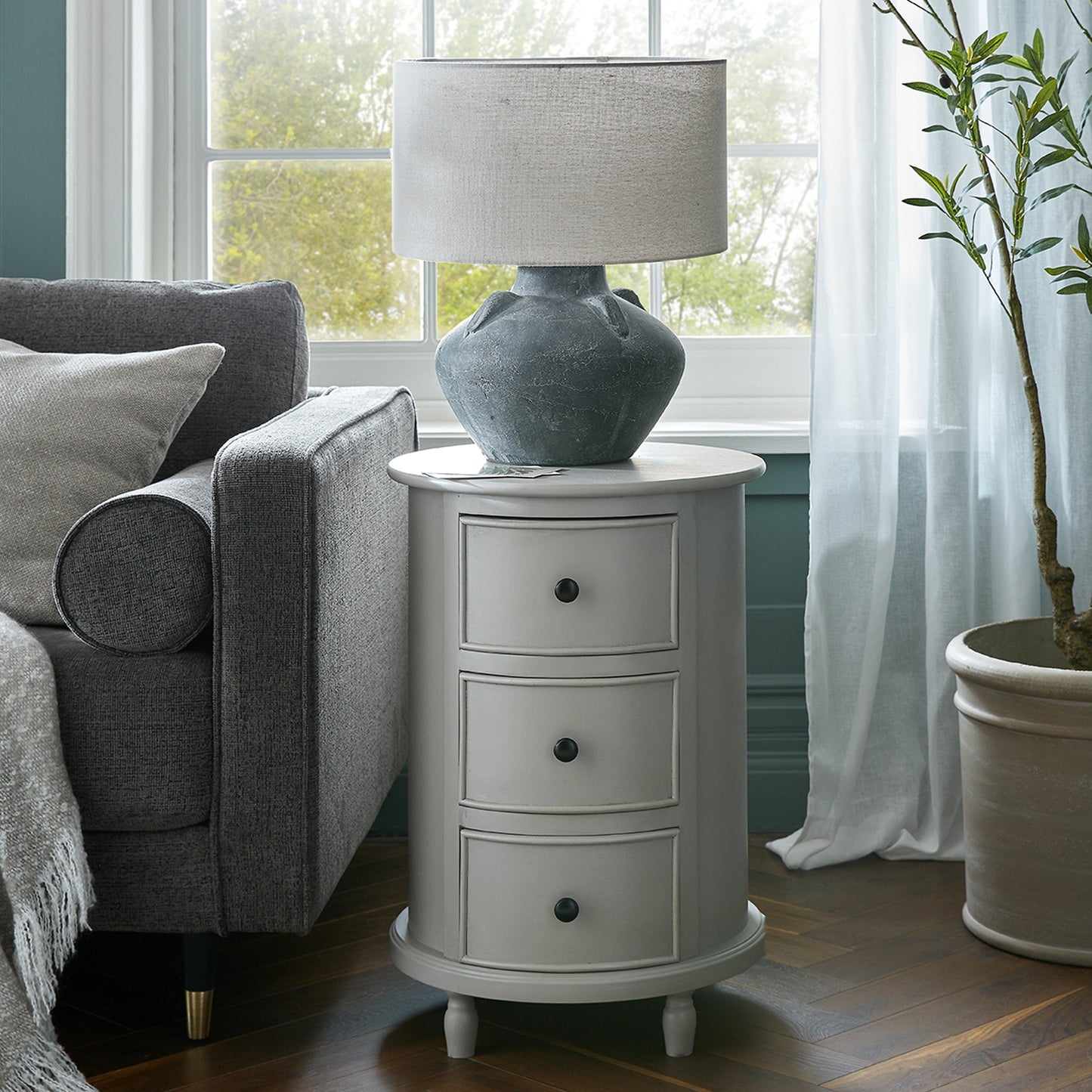 Round wooden side table with three drawers – Camden Collection