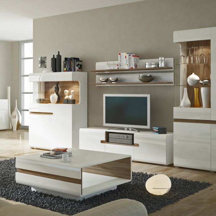 Wide white high gloss TV unit with truffle oak trim, open shelf and soft-close doors, ideal for modern living rooms.
