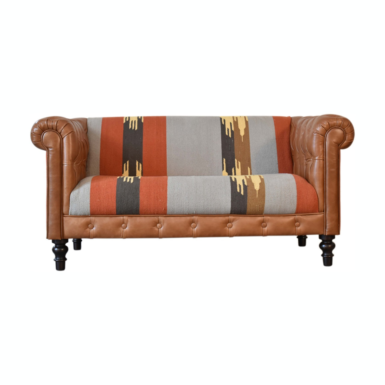 Handcrafted Kilim and Leather Chesterfield Sofa featuring a tufted tan leather frame, traditional rolled arms, and a bold multicolour kilim upholstery with geometric patterns, blending rustic charm and contemporary design.