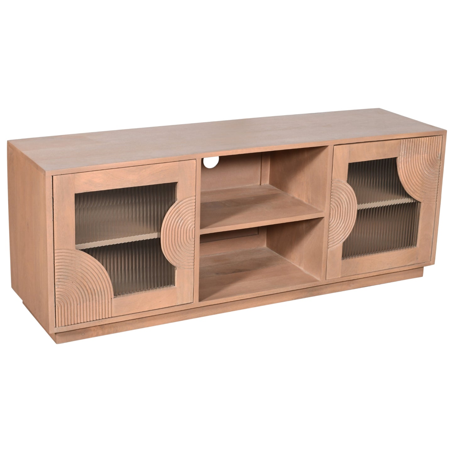 Indus solid mango wood TV cabinet with fluted glass doors, pale taupe lacquered finish, and open shelf storage for media devices, styled in a neutral-toned living room.