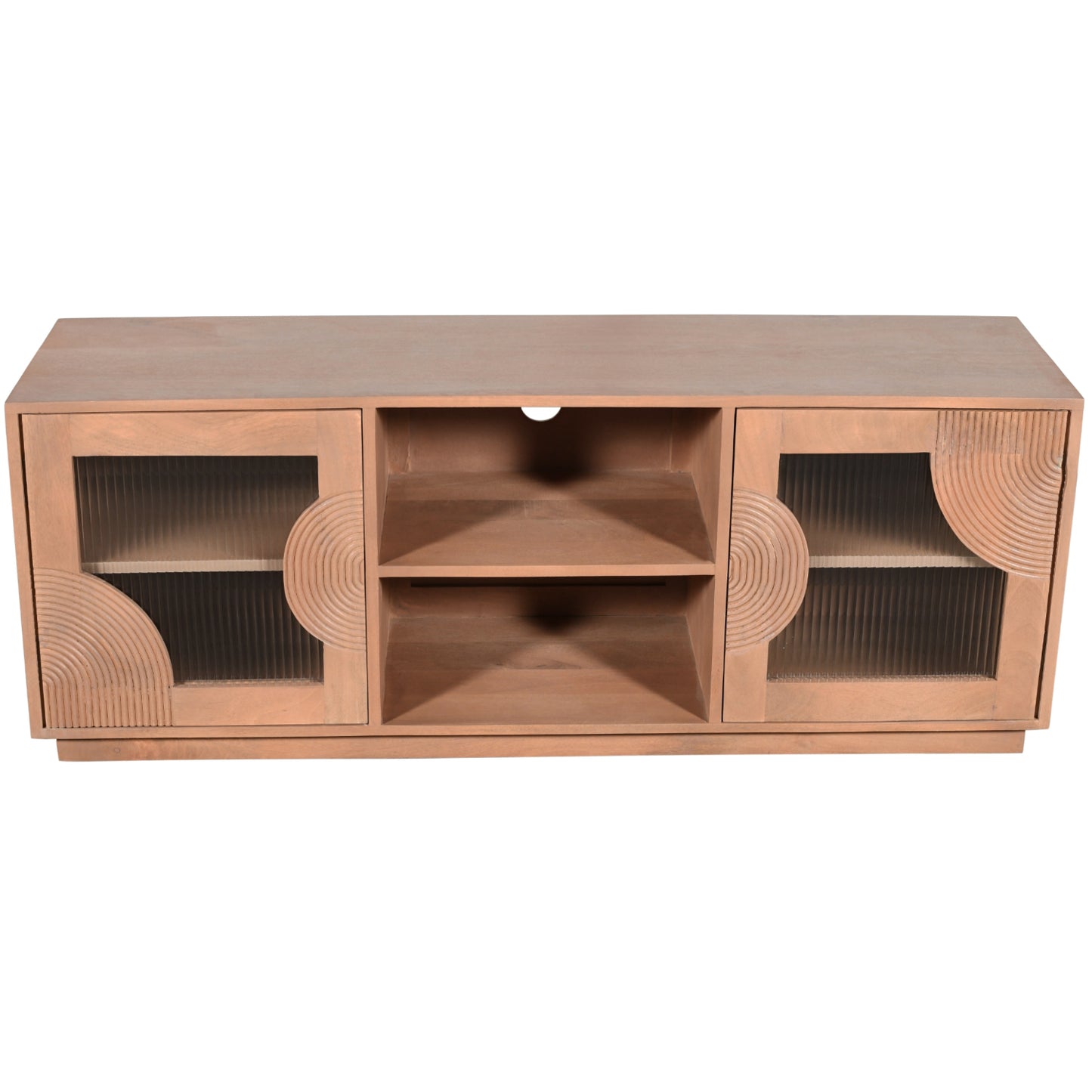 Indus solid mango wood TV cabinet with fluted glass doors, pale taupe lacquered finish, and open shelf storage for media devices, styled in a neutral-toned living room.