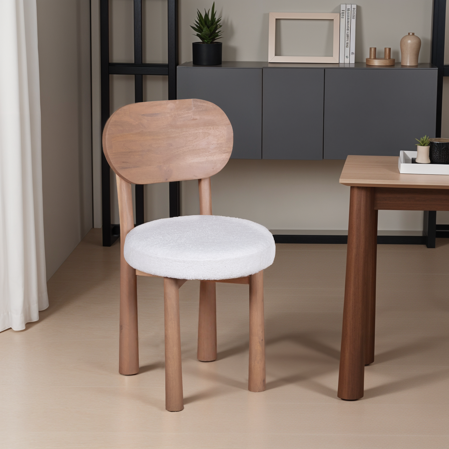 Indus dining chairs in natural solid mango wood with minimalist design and smooth finish, styled around a matching wooden dining table in a modern interior.