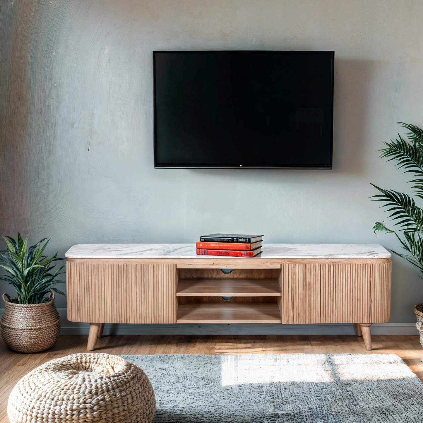 Ashford large TV cabinet with natural marble top and ribbed pale taupe mango wood body, featuring gold accents and modern storage layout in a minimalist living room.