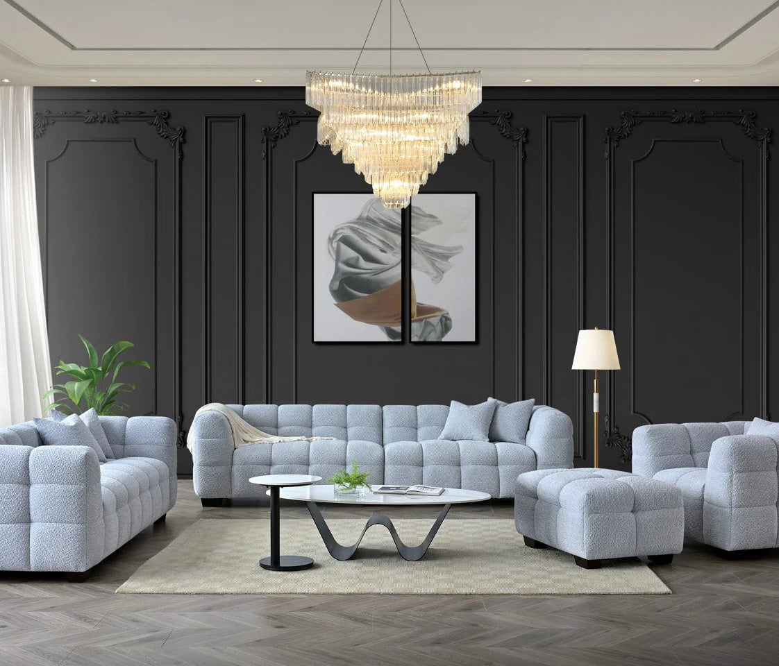 Modern 4 seater sofa in pearl bouclé with deep channel tufting and curved silhouette, designed with Chesterfield influence for contemporary interiors.