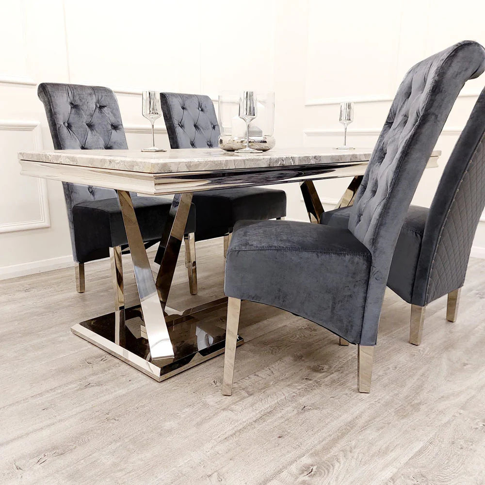 Emma dining chairs in cream velvet with tall scroll top, button stud detailing, quilted back and chrome lion knocker, paired with chrome legs