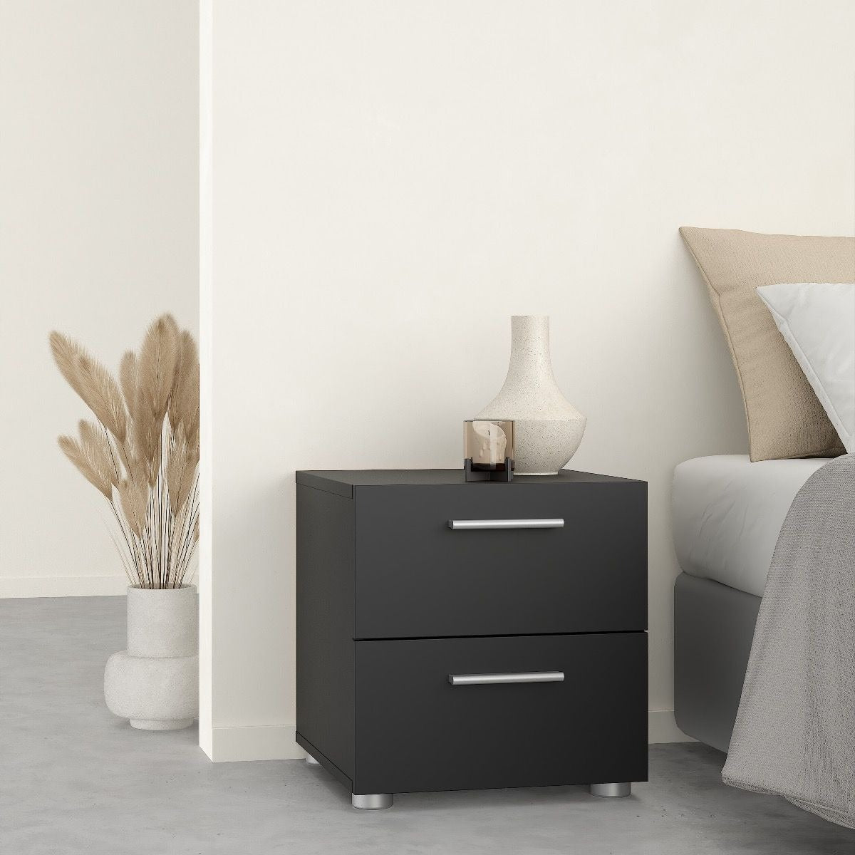 Modern oak and matt black bedroom furniture set including wardrobe and drawers.