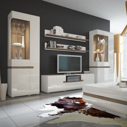 Wide white high gloss TV unit with truffle oak trim, open shelf and soft-close doors, ideal for modern living rooms.