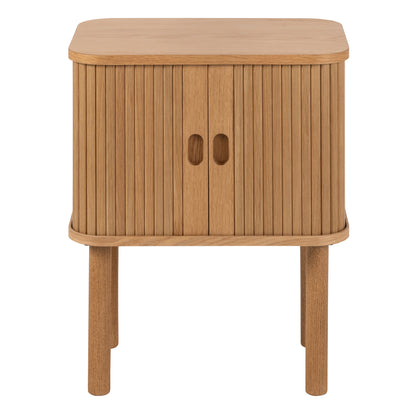 Modern oak bedside table with vertical slatted tambour doors, rounded corners, and compact square design, styled in a minimalist bedroom setting.
