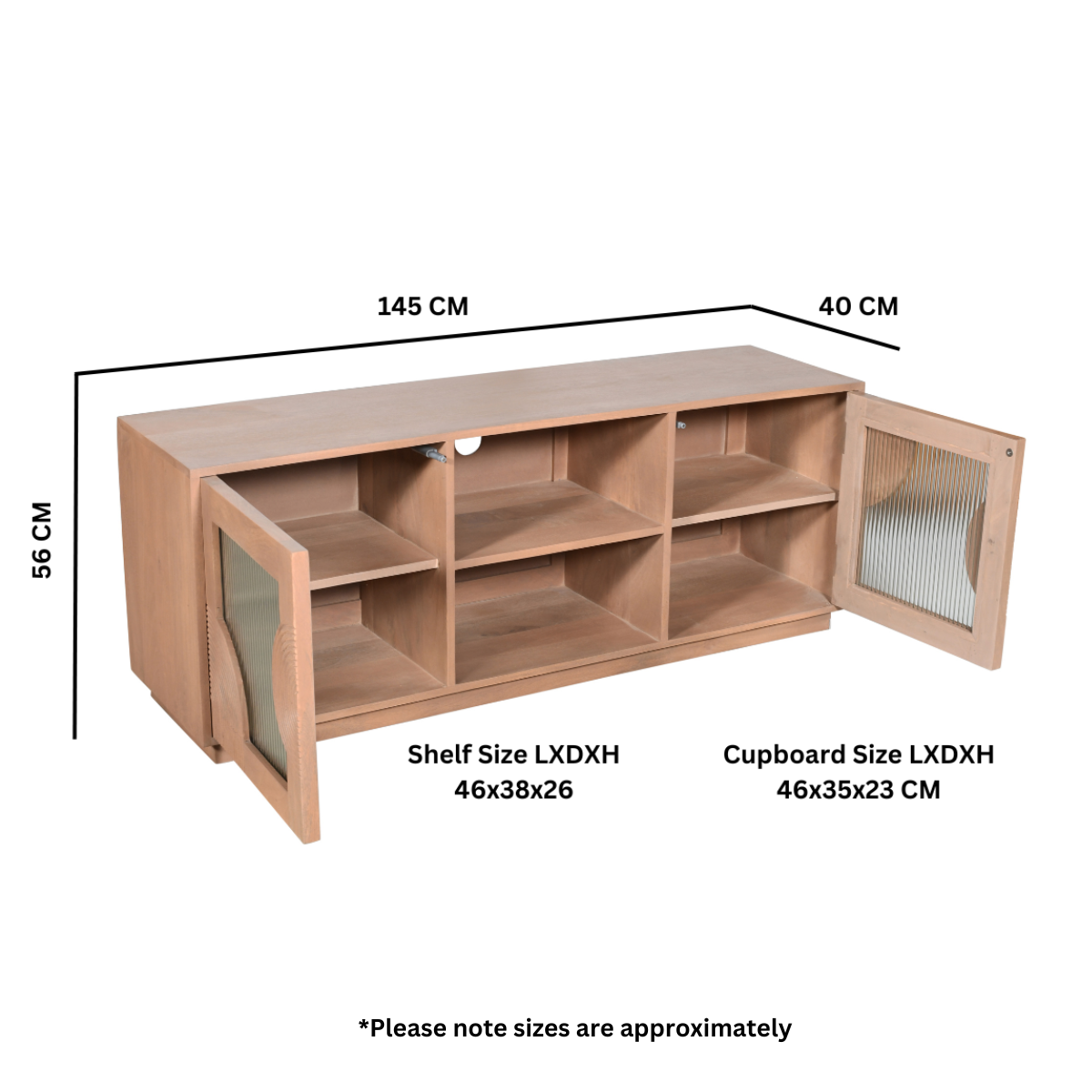 Indus solid mango wood TV cabinet with fluted glass doors, pale taupe lacquered finish, and open shelf storage for media devices, styled in a neutral-toned living room.