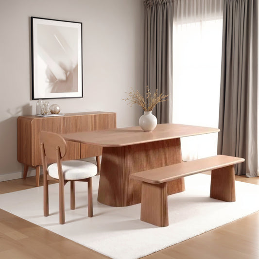 Indus dining chairs in natural solid mango wood with minimalist design and smooth finish, styled around a matching wooden dining table in a modern interior.