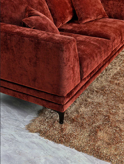 Aluxo Lenox sofa in rust velvet fabric, featuring a mid-century modern design with deep cushions, clean lines and a wooden plinth base on black legs