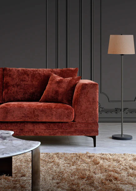 Aluxo Lenox sofa in rust velvet fabric, featuring a mid-century modern design with deep cushions, clean lines and a wooden plinth base on black legs