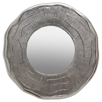 Round mirror with textured silver frame on a white background